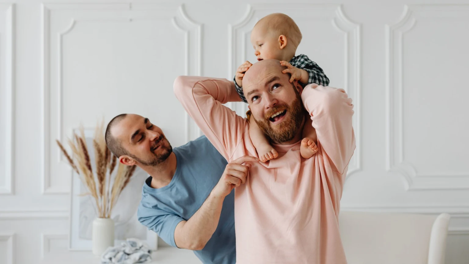 A Couple Playing with their Baby